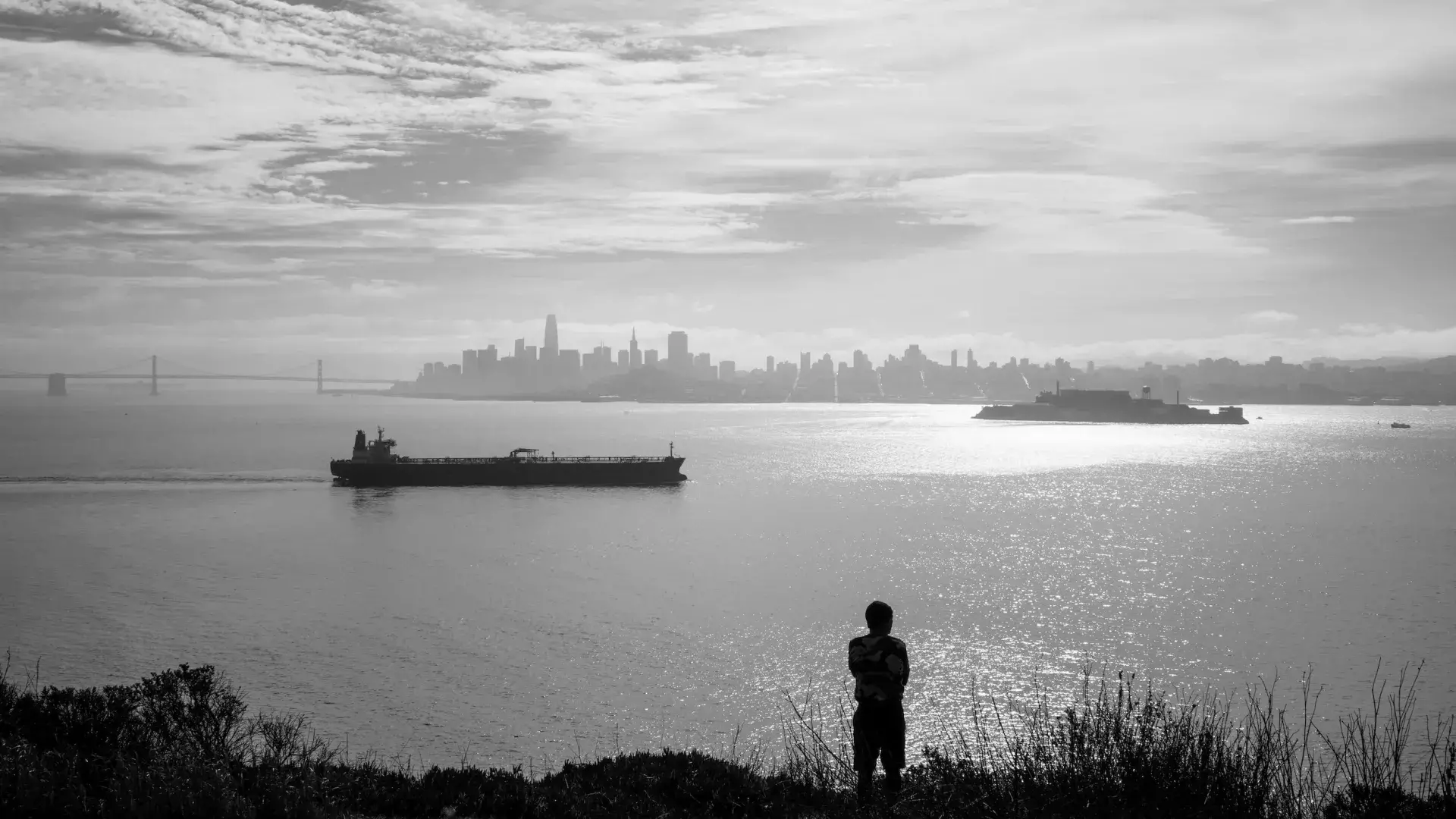 A visitor enjoys the wide views from Angel Island