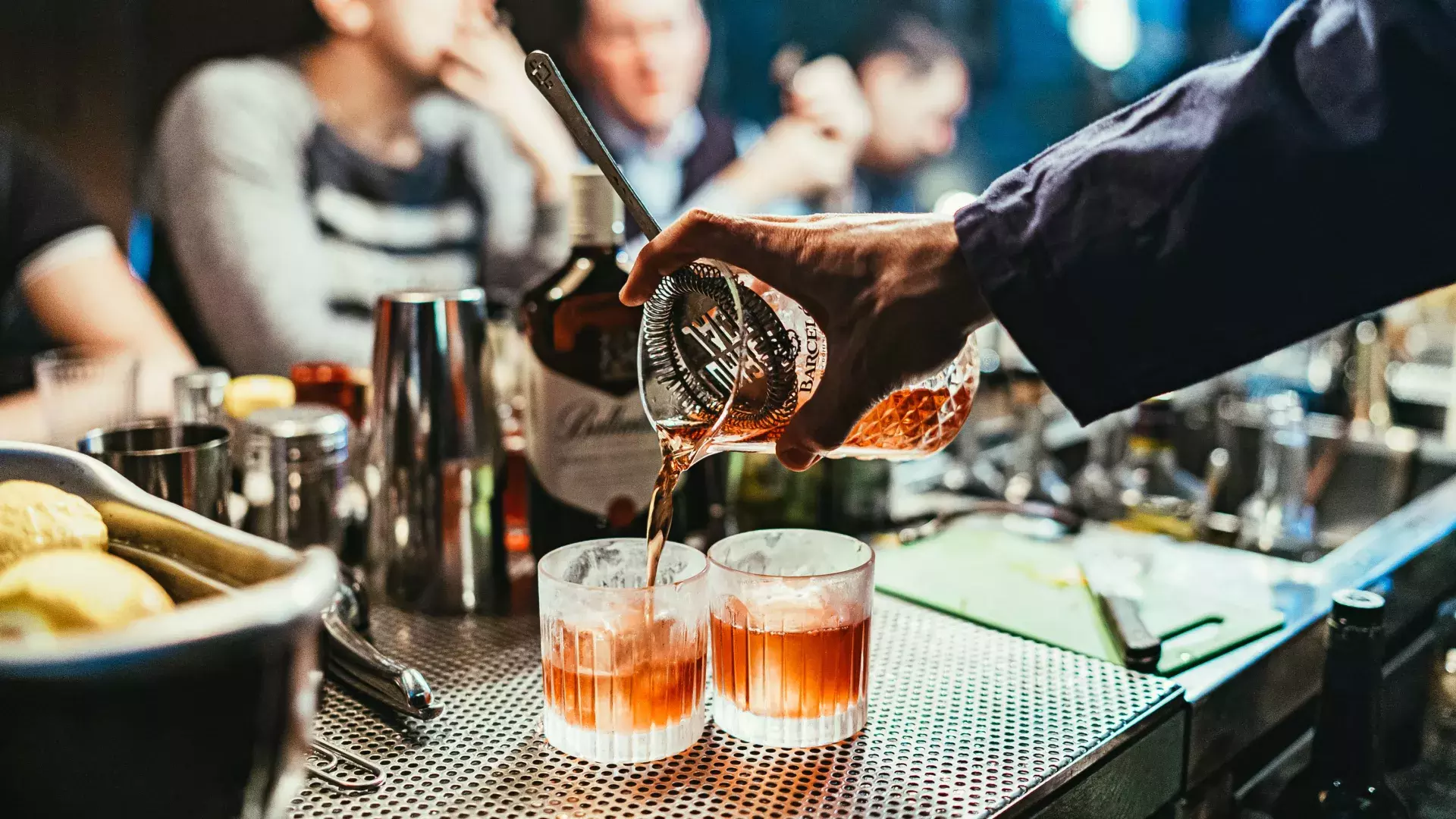 Bartender pouring cocktails