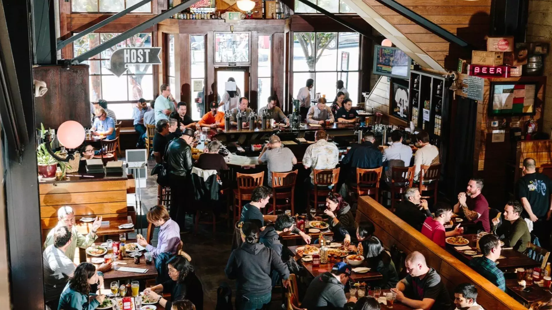 Patrons eat and drink inside the 21st Amendment Brewery in San Francisco.