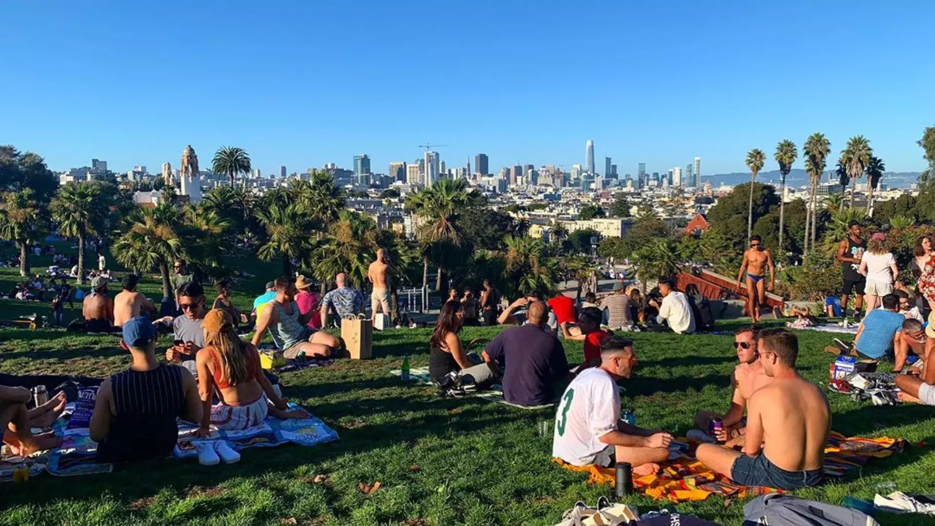 Groups of residents and visitors alike enjoy picnics in Dolores Park.