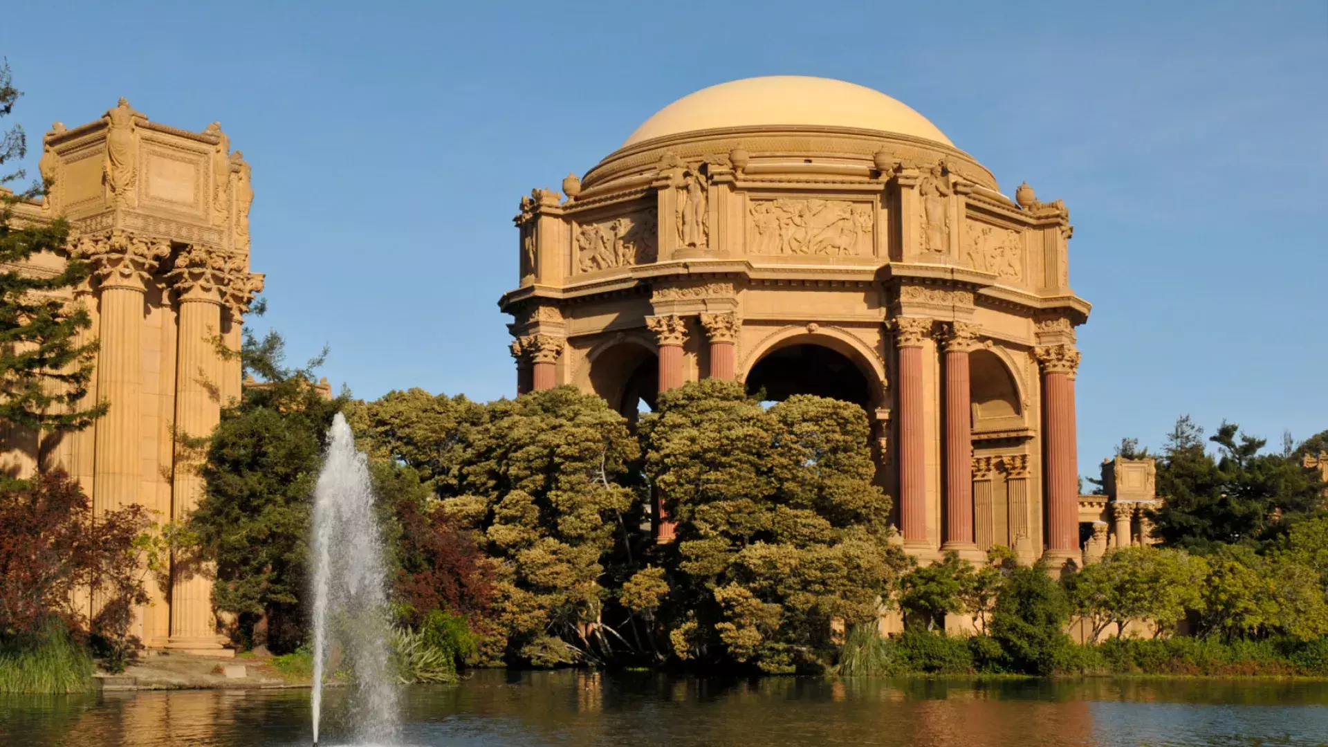 Exterior of the Palace of Fine Arts, with its lake and water fountain.