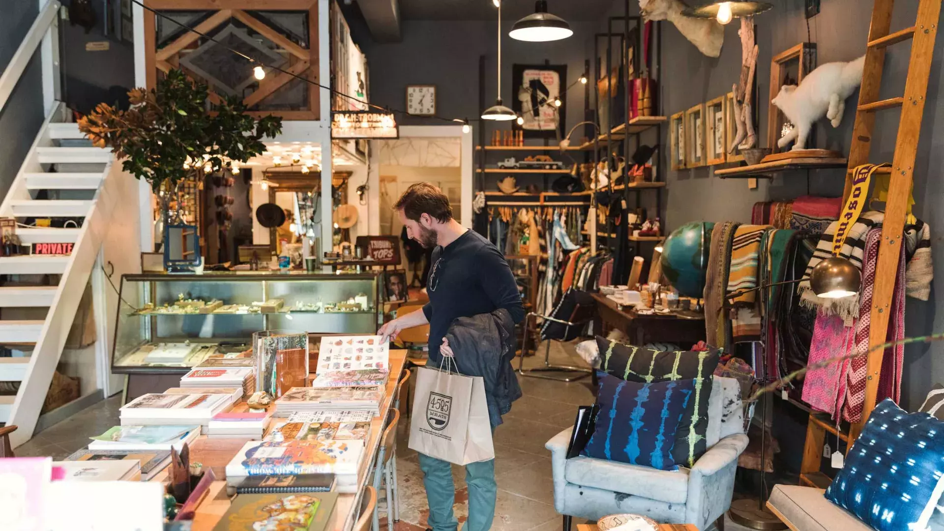 A man shops for items inside a boutique in San Francisco's NoPa neighborhood.