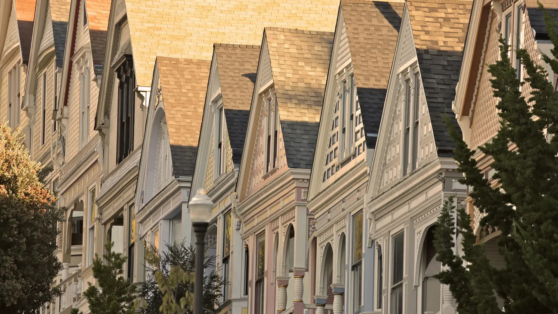 Close up of a row of Victorian houses in the Castro district of San Francisco.