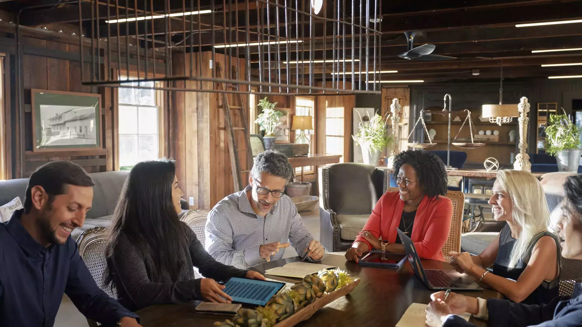 A group collaborates at a meeting in Monterey.