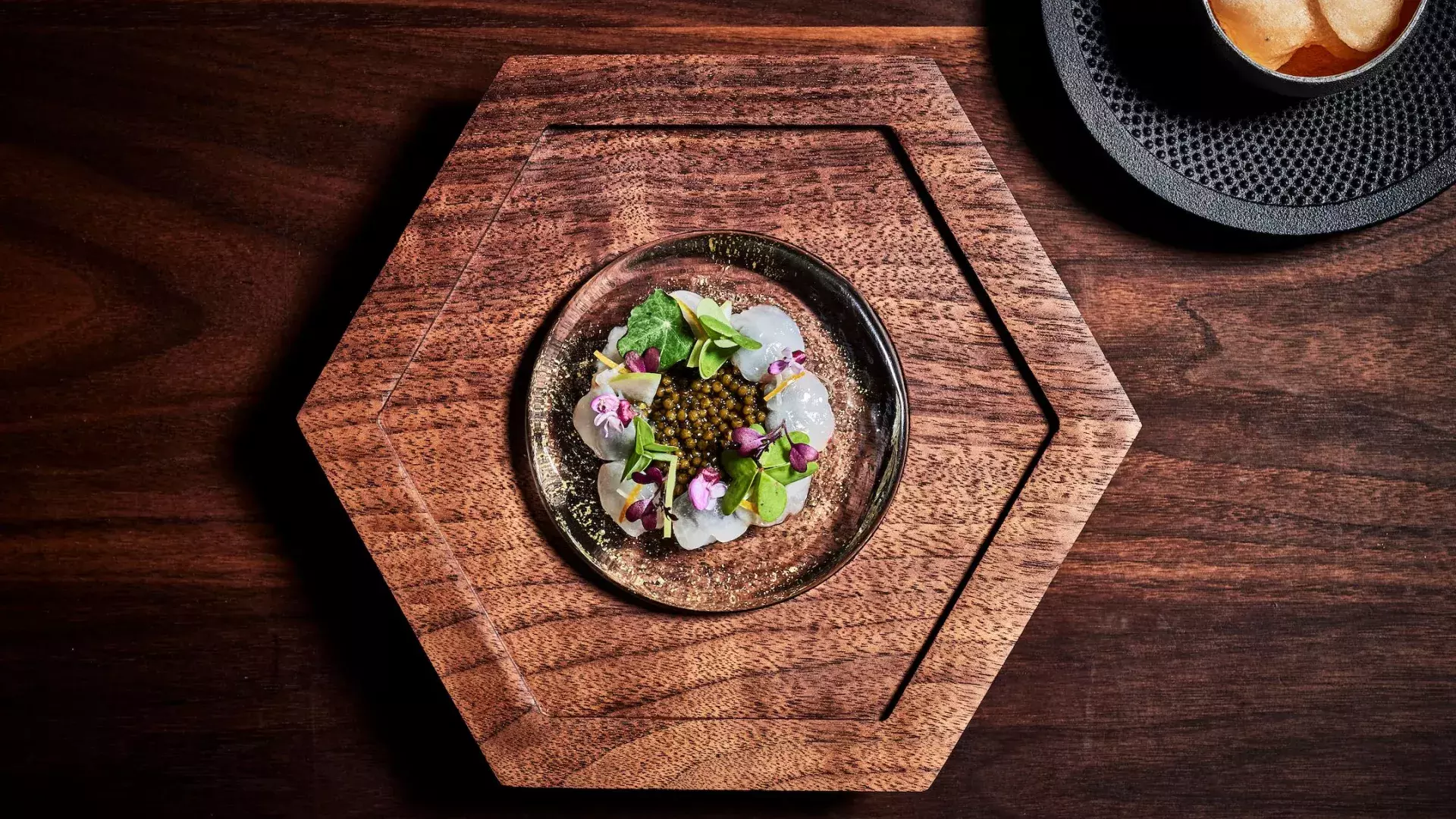 Dish served on hexagonal wooden dish at Aphotic