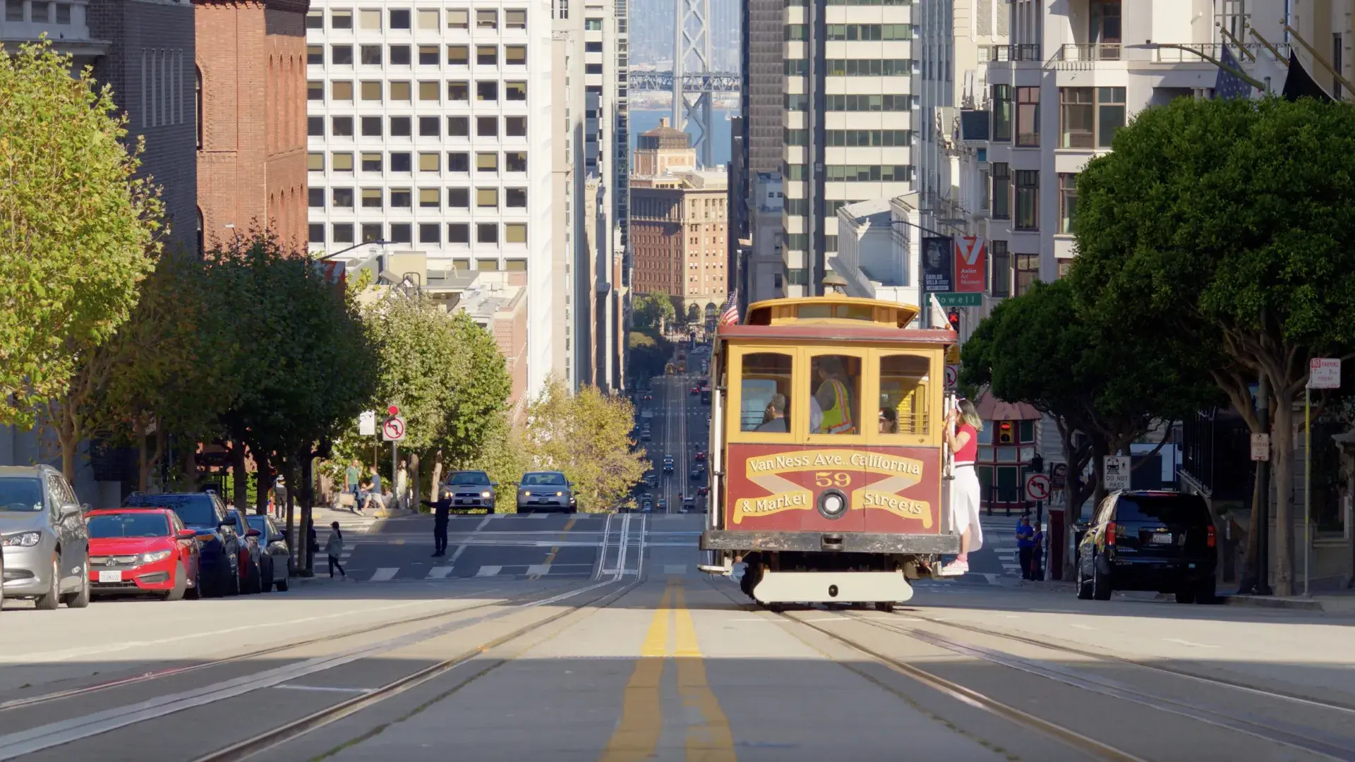 cable car driving down California Street