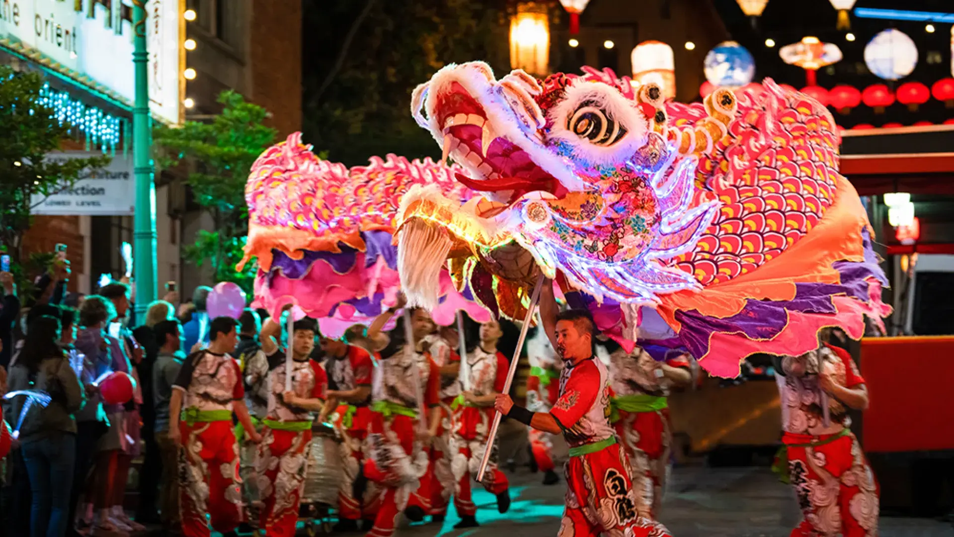 Dancers manipulate a giant, illuminated dragon during San Francisco's Lunar New Year Parade.