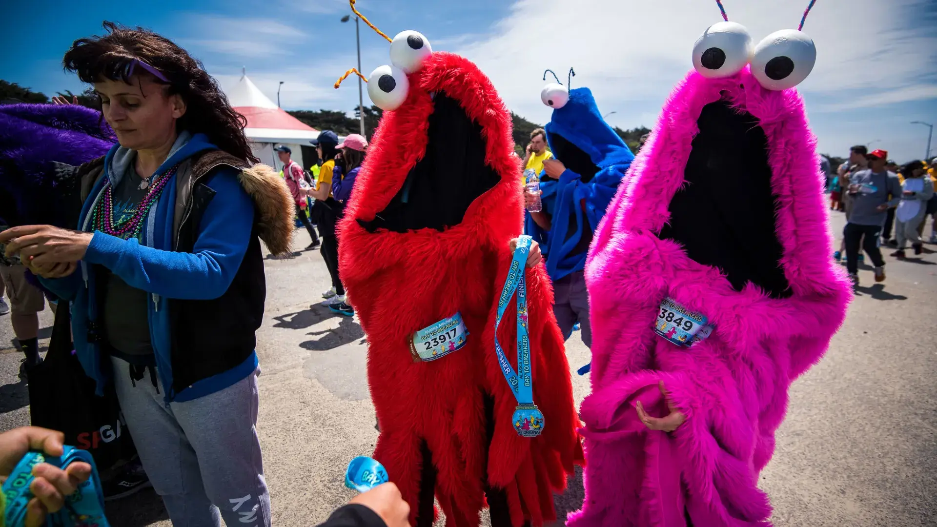 Image of two people in fuzzy costumes  with race numbers for Bay to Breakers