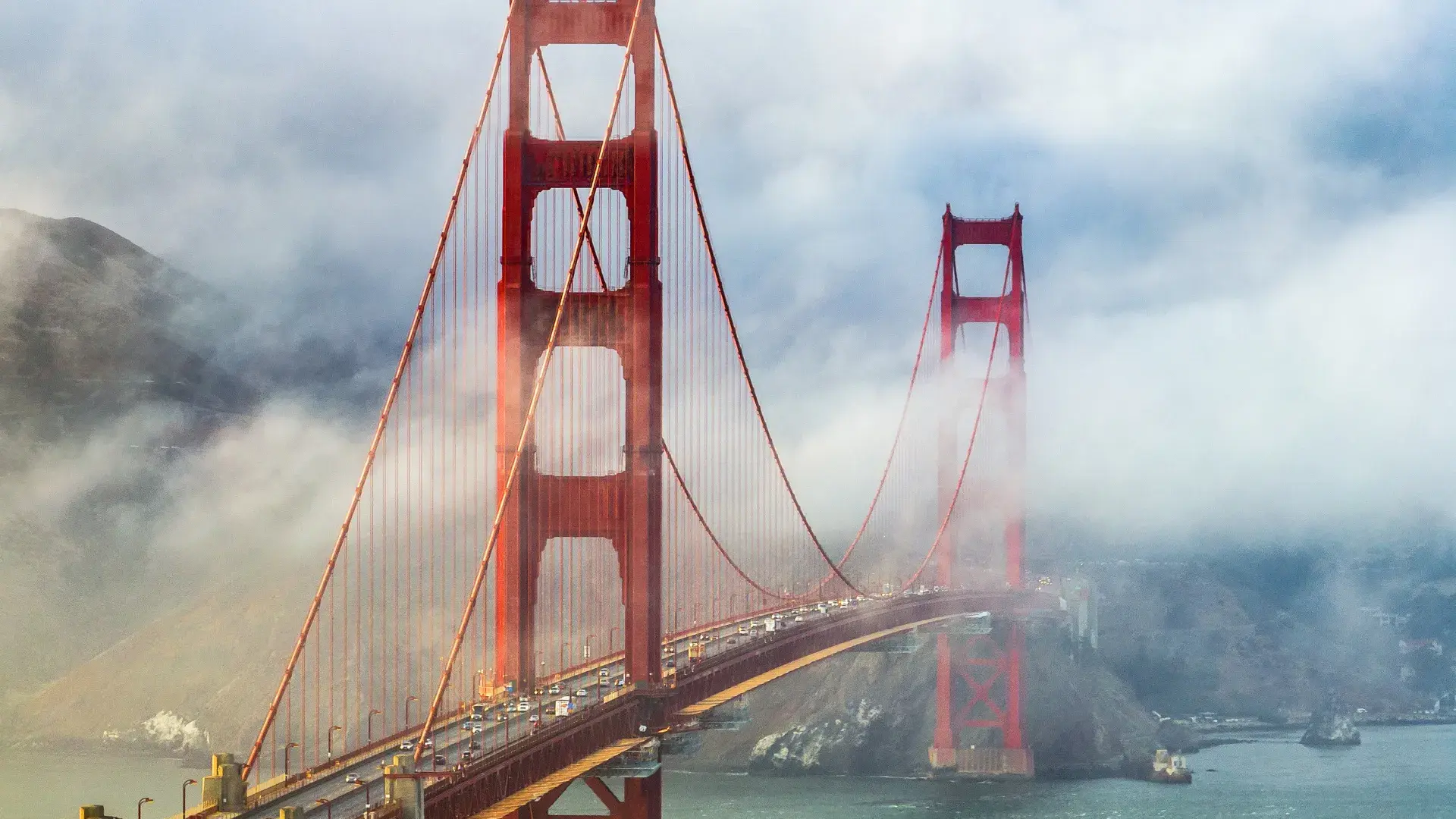 Golden Gate Bridge peaking out from behind the fog