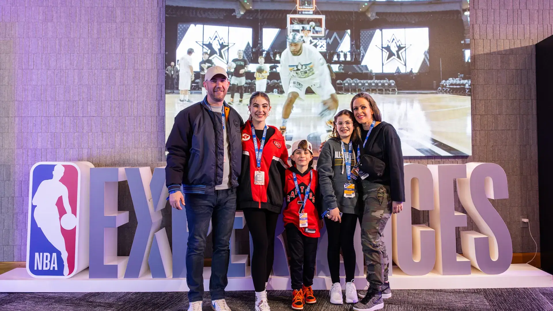 A family of basketball fans attends the NBA All-Star Game festivities.