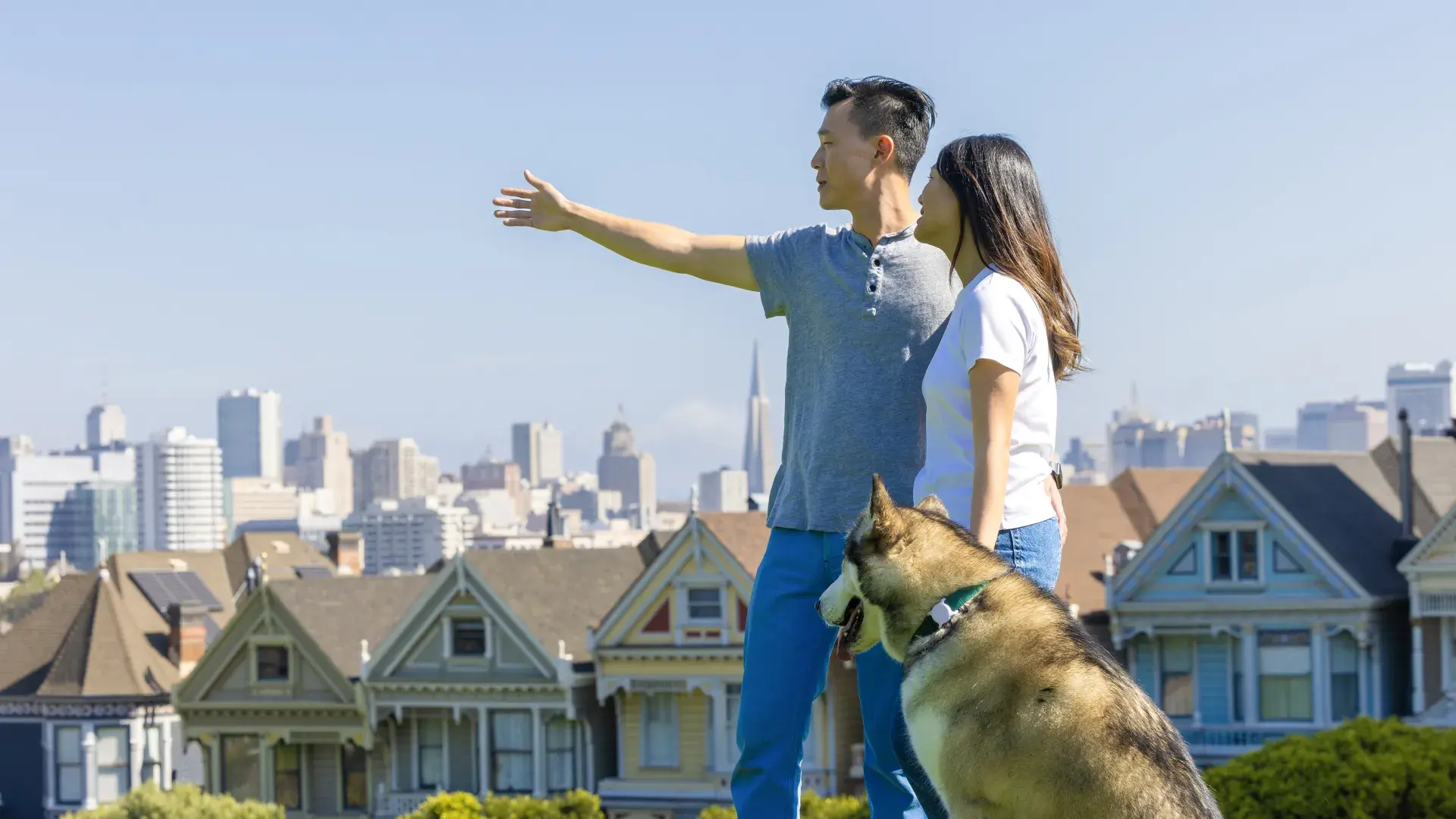 Couple in Alamo Square Park with Husky dog 
