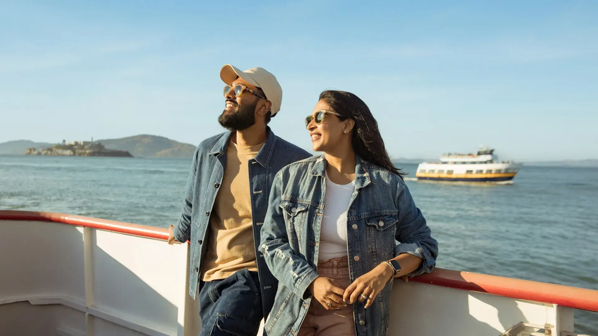 Couple looking off into the distance while cruising on the bay