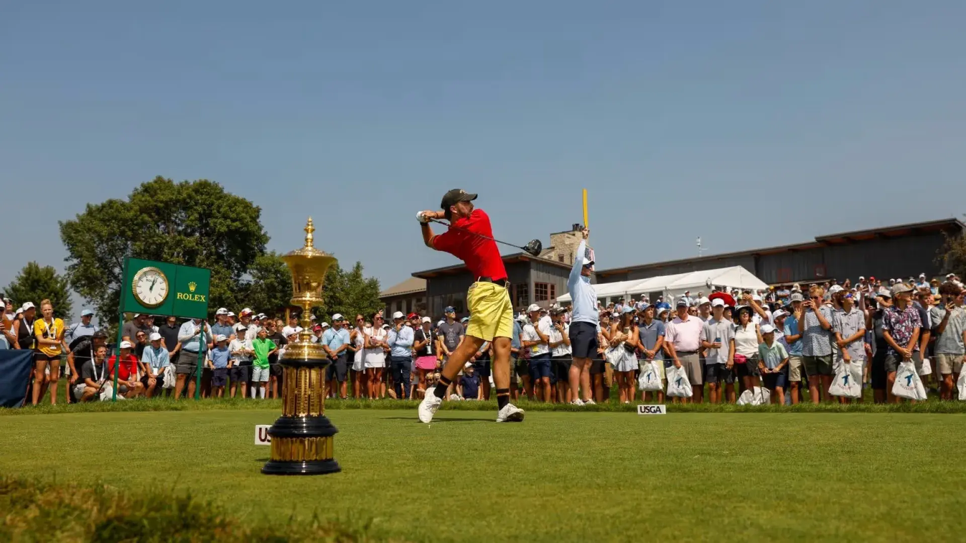 Spectators watch from the fairway at the USGA Amateur Championship.
