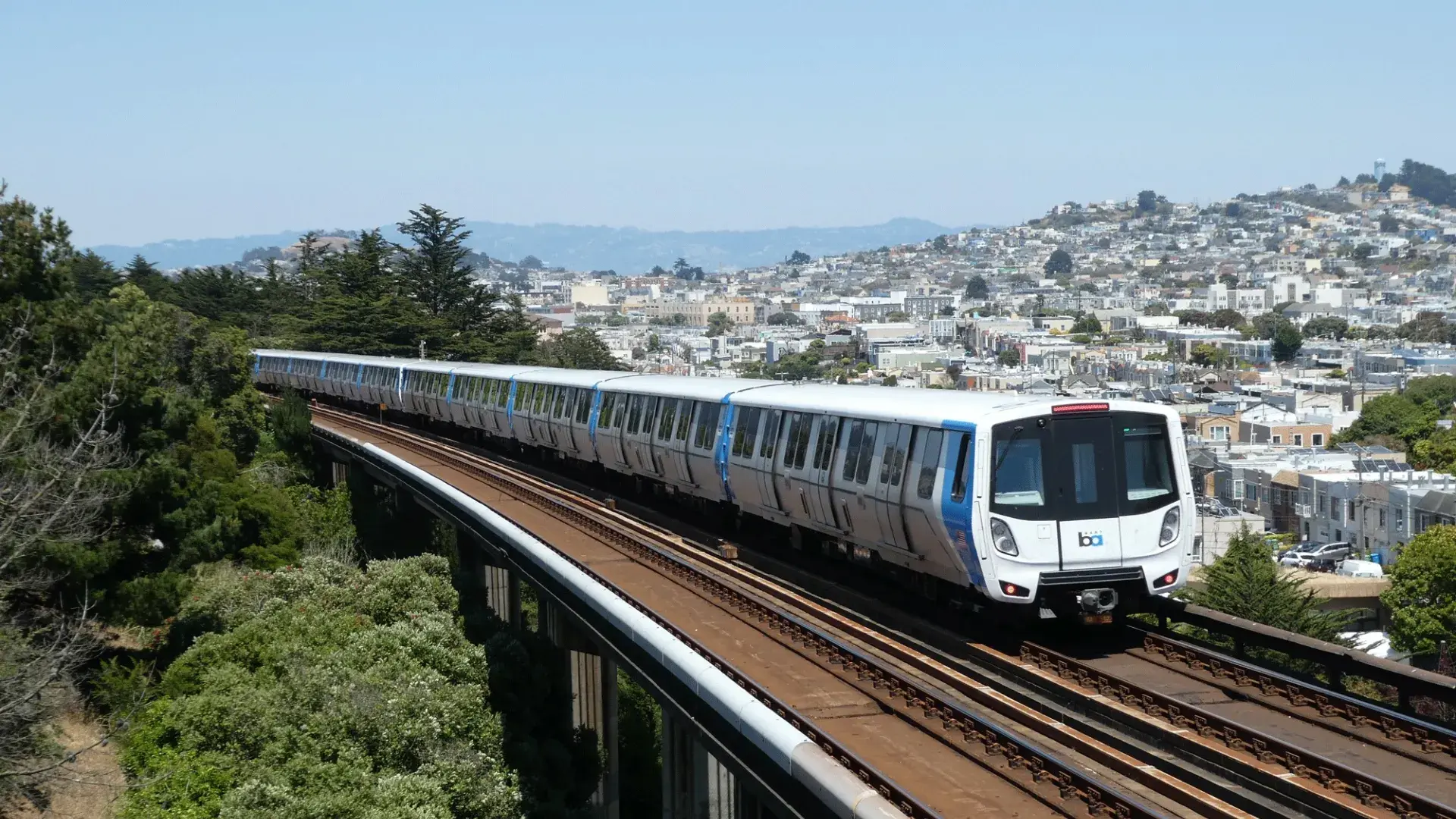 A BART train rides through San Francisco.