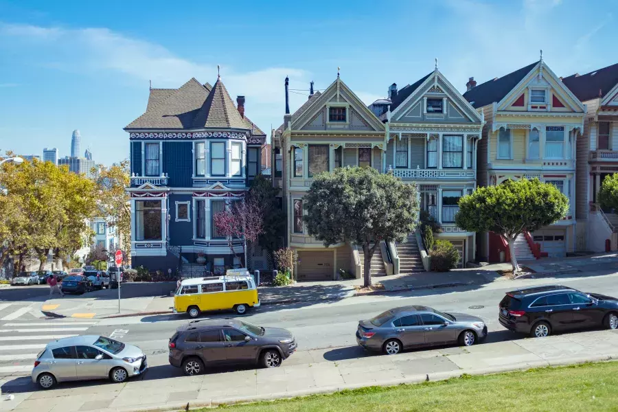 Cars parked in front of the Painted Ladies