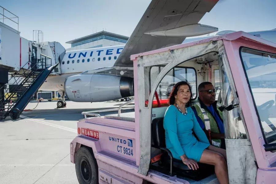 Melinda Yee Franklin sitting in a cart.