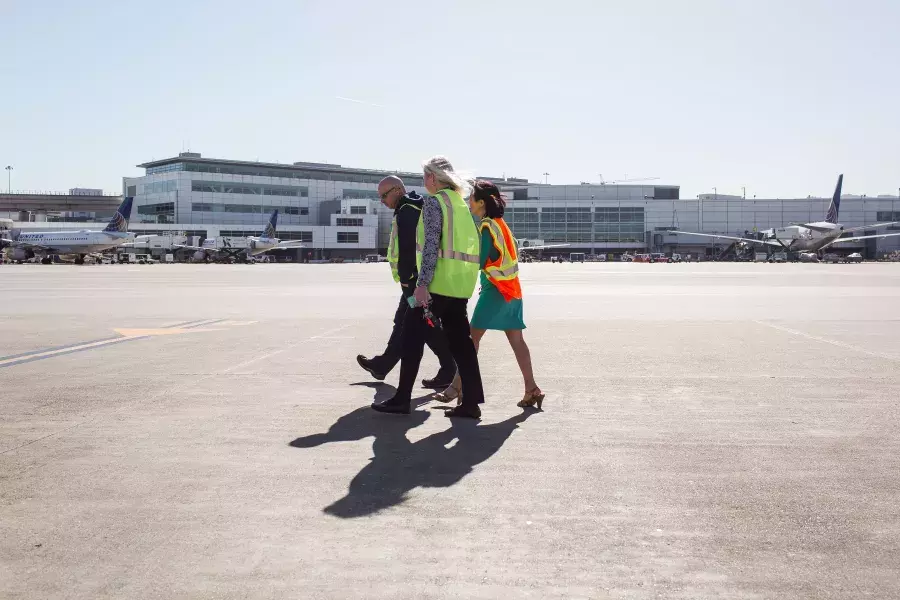 Melinda Yee Franklin walking on the SFO runway.