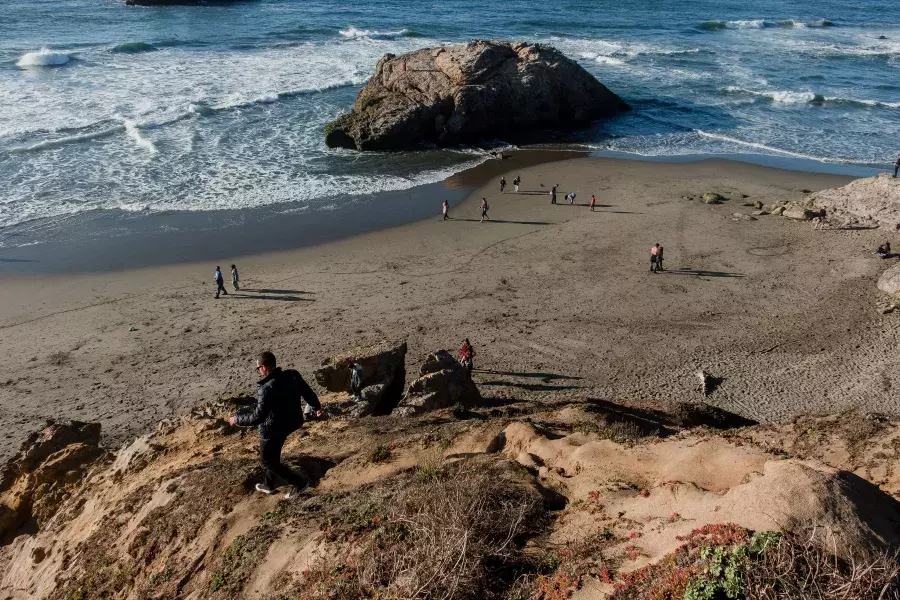 Nick Whittlesey walking down to Ocean Beach