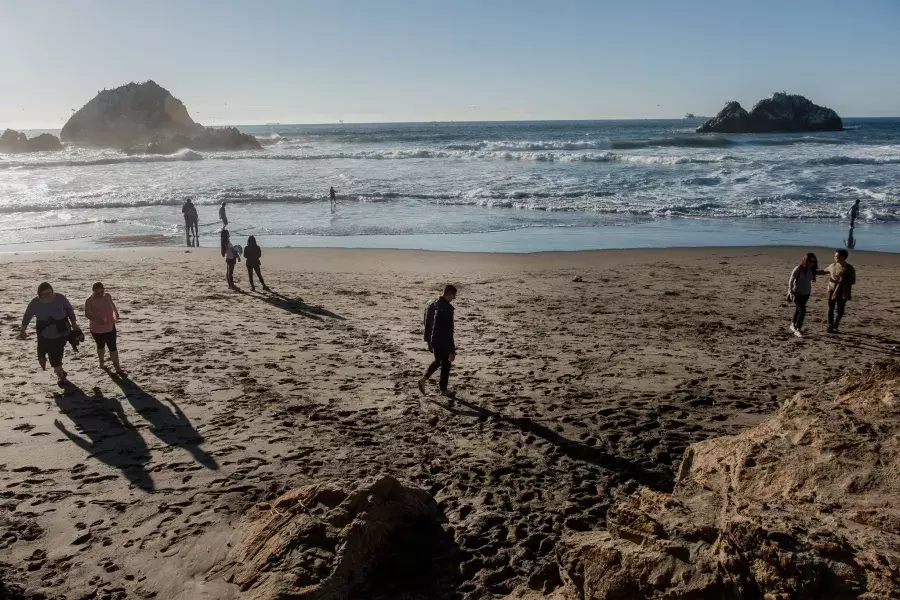 Nick Whittlesey walking on Ocean Beach