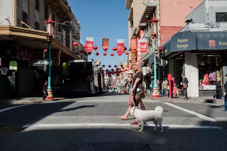 Nya Cruz walking with her dog in Chinatown.