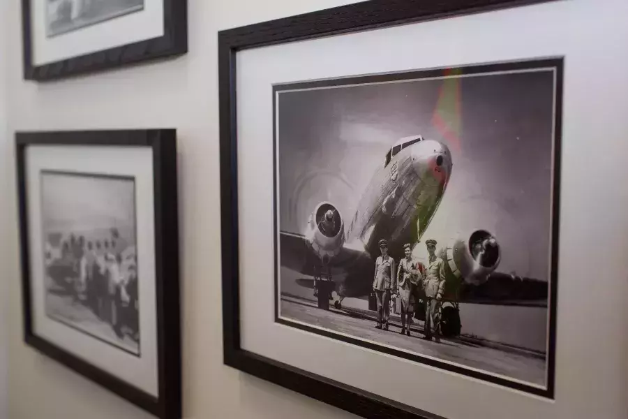 Old photographs of United planes on the wall.