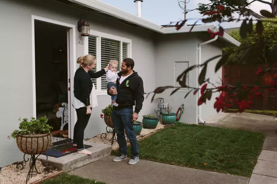 Romulo Melo at home with his family.