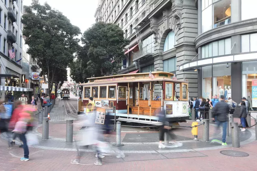 A San Francisco cable car is manually turned at the Powell Cable Car Turnaround.