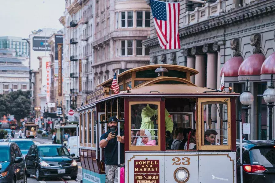 A cable car approaches the camera in Union Square. San Francisco, California.