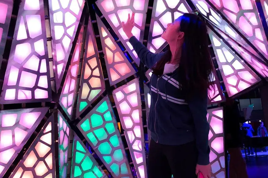 Woman interacting with exhibit at Exploratorium 