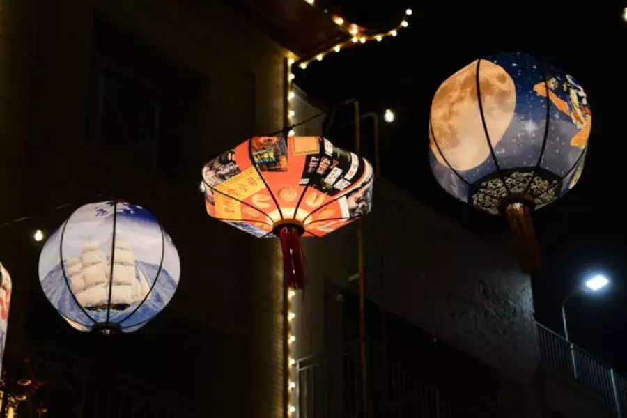 Lanterns glow above Chinatown streets.