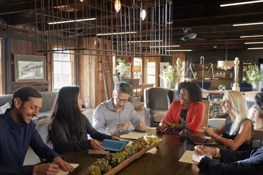 A group collaborates at a meeting in Monterey.