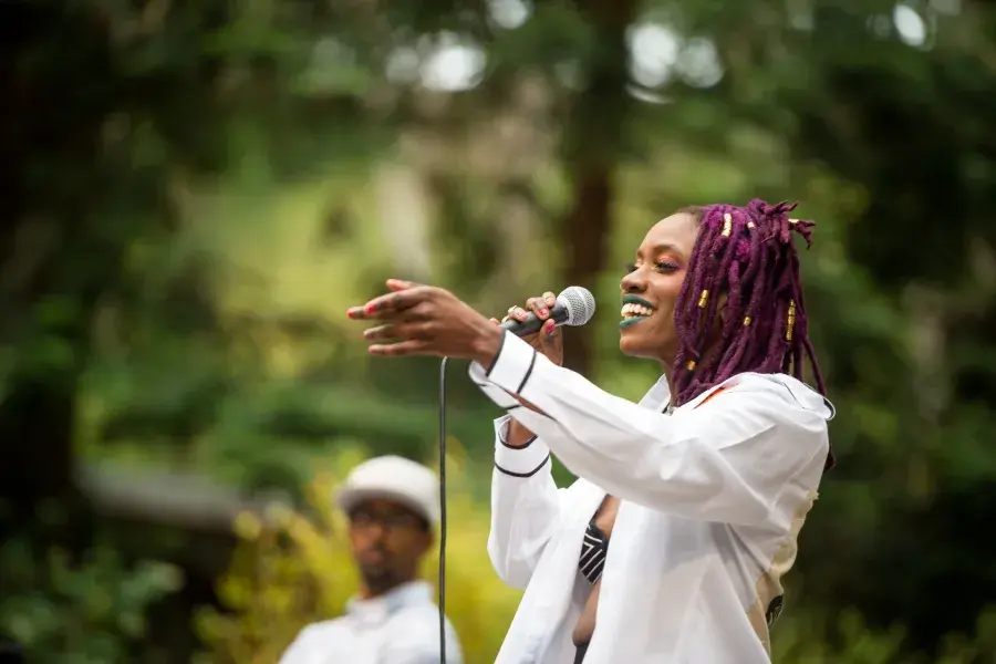 A woman sings at Stern Grove.