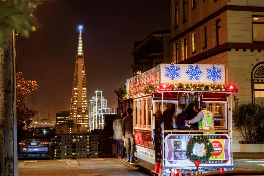 The cable cars are decorated for the holidays.