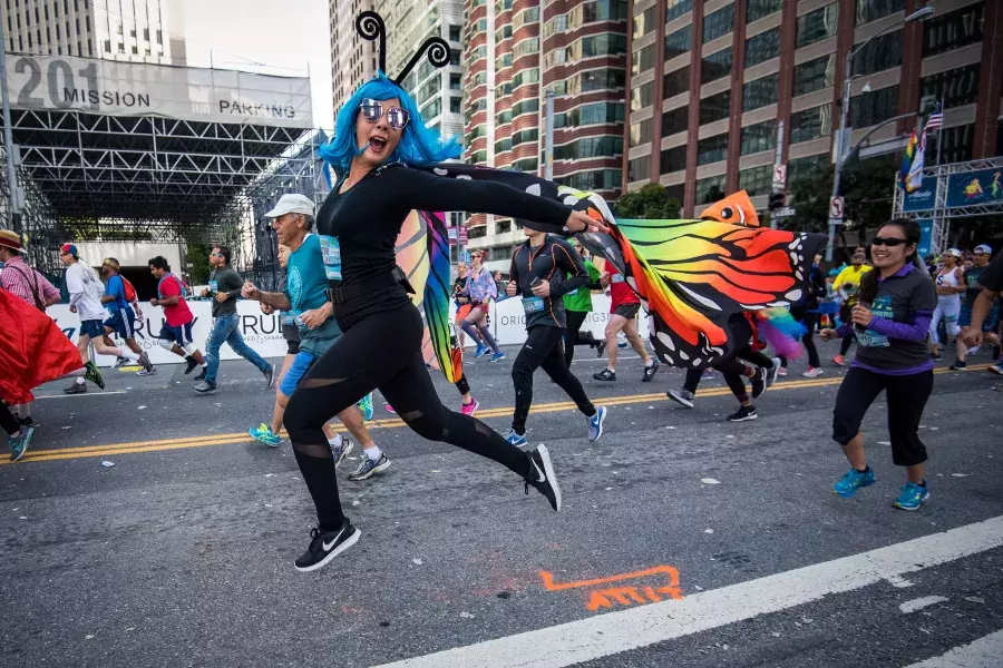 Woman in butterfly costume running Bay to Breakers race 