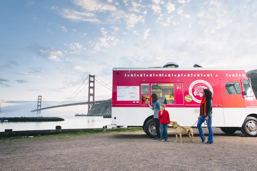 Visitors enjoy ice cream from the Garden Creamery truck.