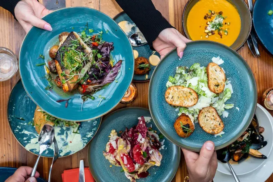 Food is sharing among friends at Fable in the Castro