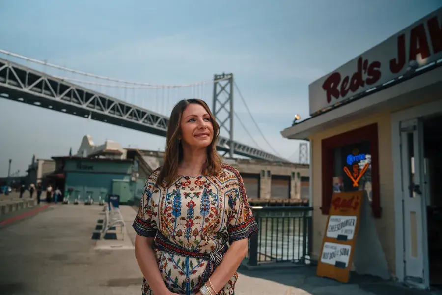 Tiffany Pisoni, owner of Red's Java House, stands outside her restaurant