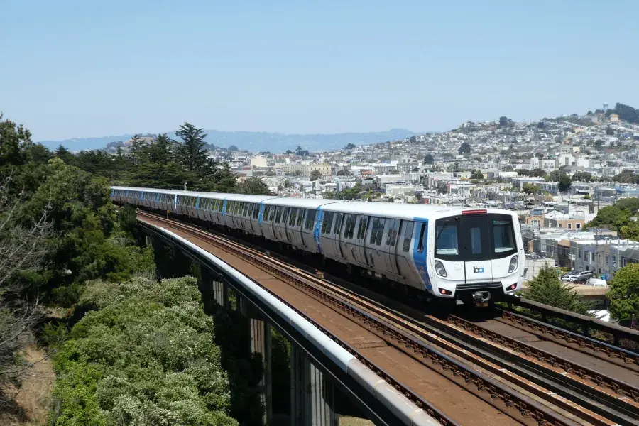 A BART train rides through San Francisco.
