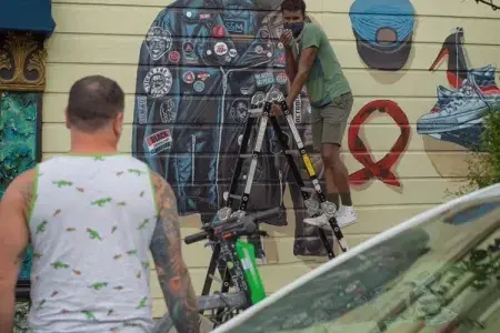 Serge Gay Jr painting his mural last year