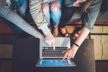 Women pointing at a computer screen