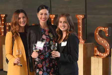 People posing for a photo at a Partner Business Exchange