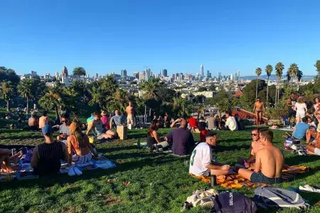 Groups of residents and visitors alike enjoy picnics in Dolores Park.