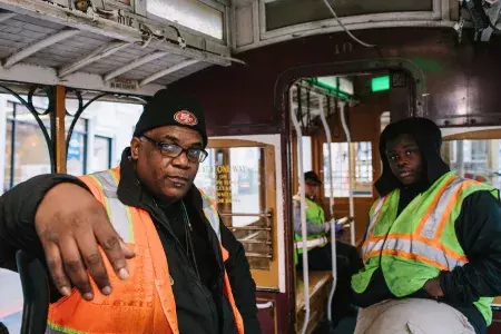 Ellis Cato and his son on a cable car.