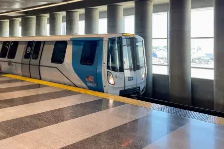 A BART train waits for passengers at the station.