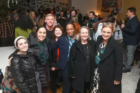 Staff and members gather at an official San Francisco Travel event.