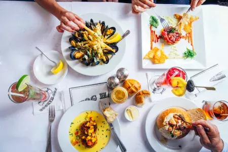 Hands over seafood dinner