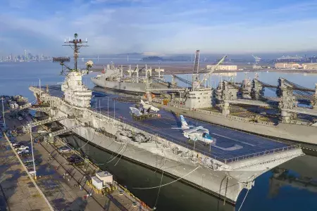 exterior of the the uss hornet in Alameda California with SF in the background. 