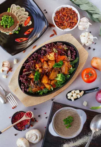 A table full of delicious vegetarian and vegan dishes.