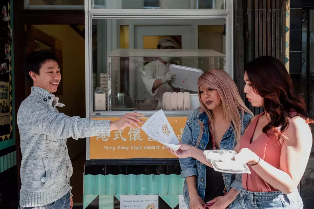 Nya Cruz and friend looking at a menu in Chinatown