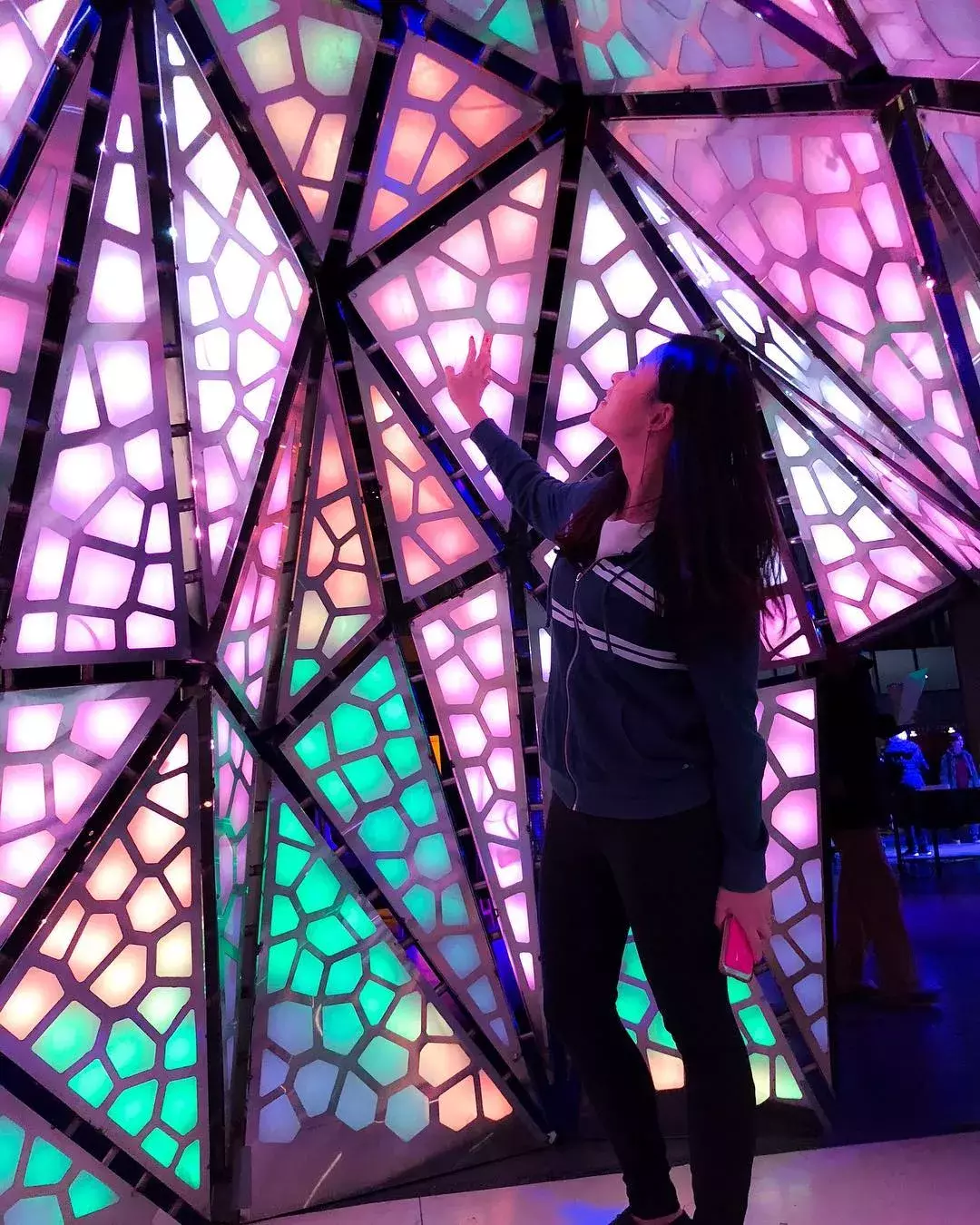 Woman interacting with exhibit at Exploratorium 